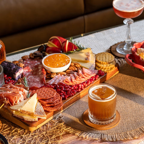 Charcuterie board with fig cocktail. 